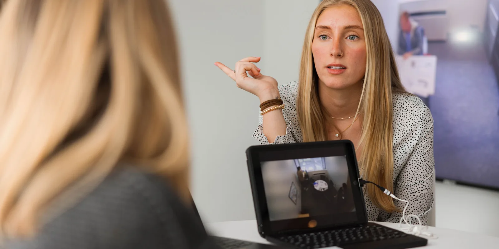 wid_trgc_hero Woman in interview with student