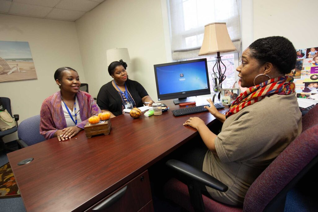 social worker talking with clients in office